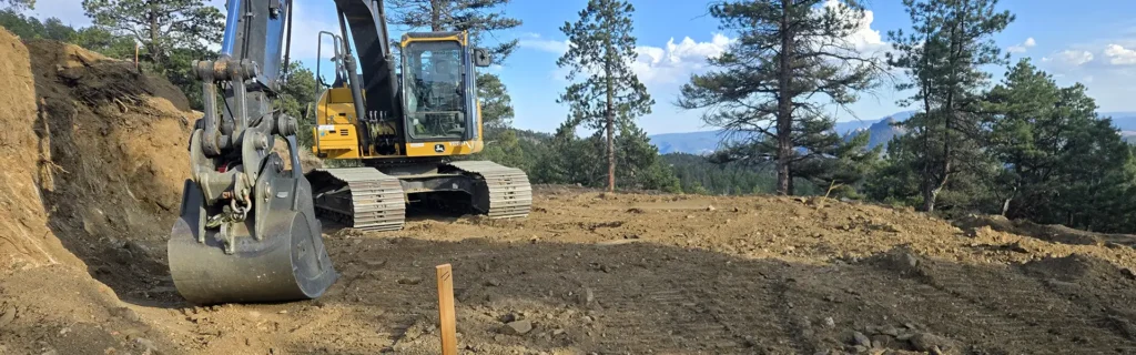 excavator clearing lot